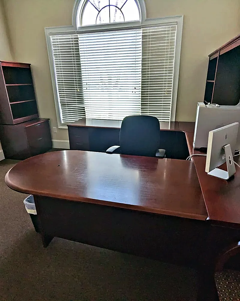 Private office with a desk, cleaned